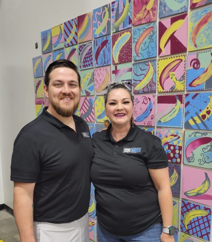 Rachel & Tom in front of the Banana Wall